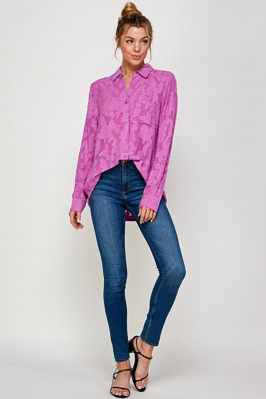 Model wearing a pink Luna Mesh Blouse with jeans, showcasing a stylish and modern look.