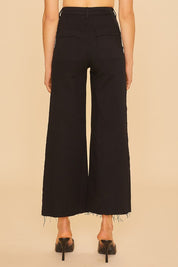 Woman wearing Renley Wide Leg Jean in black, shown from the back, highlighting the cropped length and wide-leg cut.