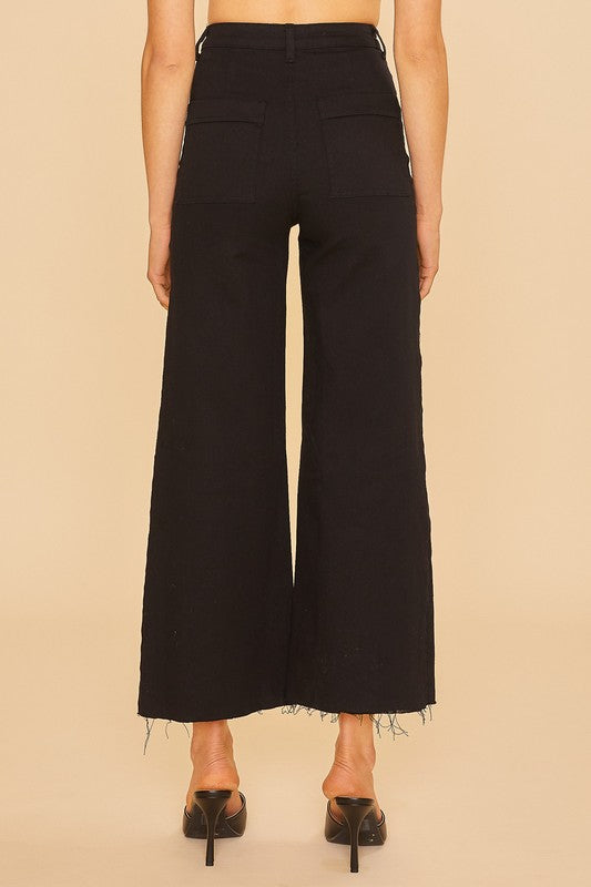 Woman wearing Renley Wide Leg Jean in black, shown from the back, highlighting the cropped length and wide-leg cut.