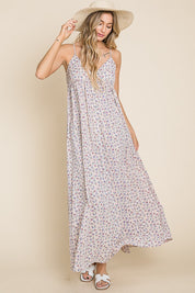 Valencia Floral Dress, a sleeveless maxi dress with a floral print, perfect for garden parties and casual outings.