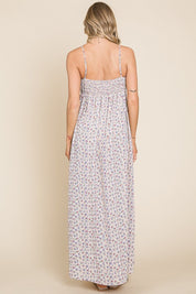 Back view of the Valencia Floral Dress, showcasing the sleeveless design and floral print in a comfortable maxi style.