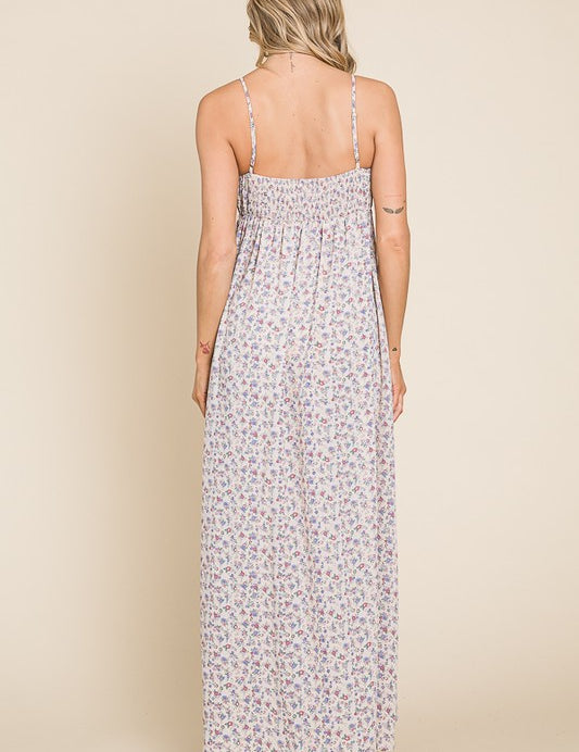 Back view of the Valencia Floral Dress, showcasing the sleeveless design and floral print in a comfortable maxi style.