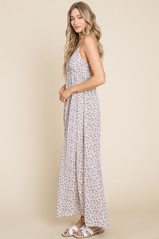 Model in a sleeveless floral maxi dress showcasing elegance and comfort, perfect for casual outings and garden parties.