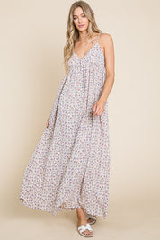 Valencia Floral Dress, a sleeveless maxi dress with a floral print, perfect for garden parties or casual outings.