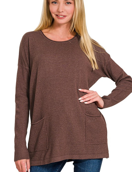 Woman wearing Elara Two Pocket Sweater in mahogany brown with jeans, showcasing front pockets and relaxed fit.