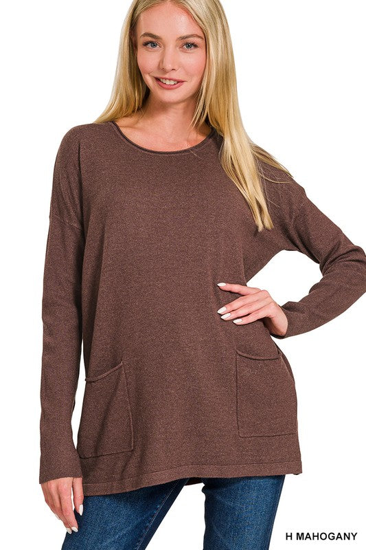 Woman wearing Elara Two Pocket Sweater in mahogany brown with jeans, showcasing front pockets and relaxed fit.