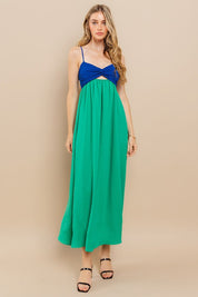 Clara Colourblock Dress: sleeveless maxi with blue twist-front and green flowing skirt, perfect for warm-weather events.