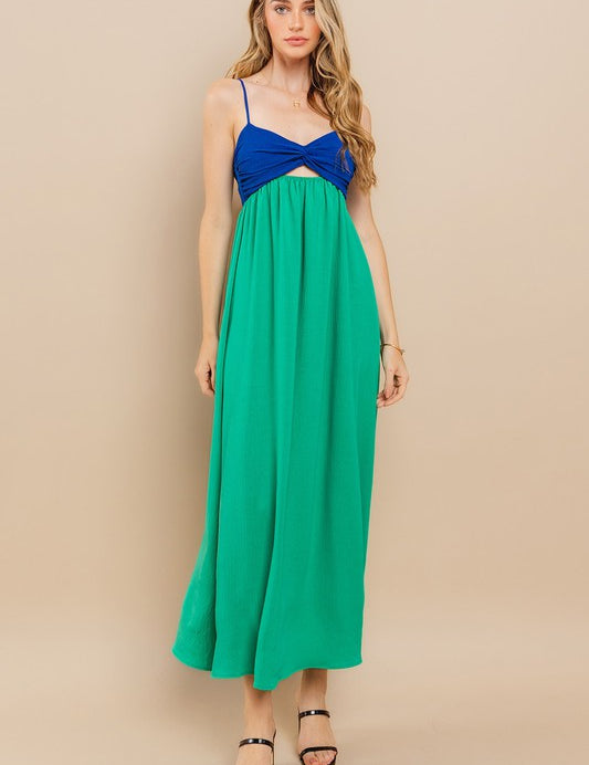 Clara Colourblock Dress: sleeveless maxi with blue twist-front and green flowing skirt, perfect for warm-weather events.