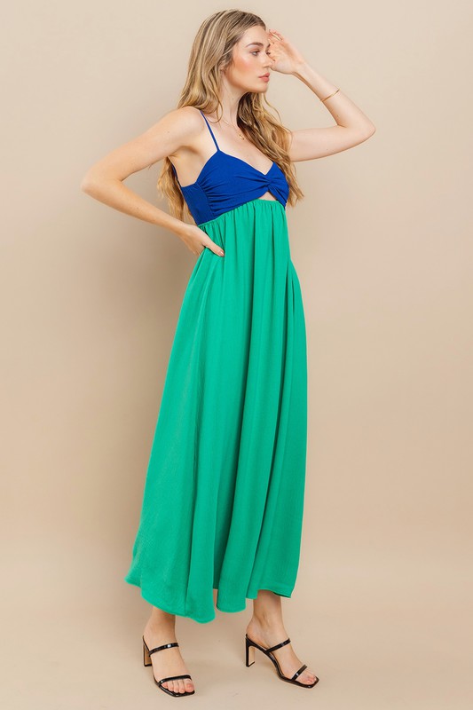 Clara Colourblock Dress showcasing a twist-front design in vibrant blue and green, perfect for warm-weather events.