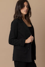 Model wearing the Piper Classic Blazer in black, showcasing its timeless design and sophisticated silhouette.