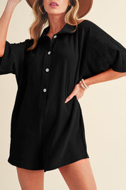 Hannah Half Button RomperThe Hannah Half Button Romper is the perfect blend of comfort and style for your warm-weather wardrobe! This versatile romper features a loose, easy fit with a half-button front and a classic turn-down collar, making it a chic cho