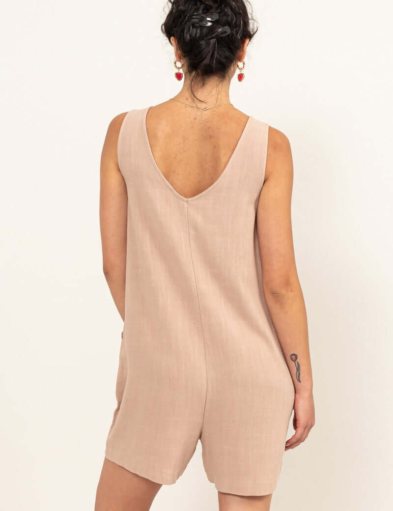 Jasmine Joy JumpsuitCrafted from a linen fabric blend, the Jasmine Joy Jumpsuit is extremely flattering and features a deep V-neck. The relaxed bodice tops a pair of breezy shorts, creating a timeless piece perfect for any occasion. Pair it with sandals a