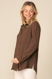 Woman wearing oversized brown Brooklyn Long Sleeve Blouse with button-down front and collared neckline.