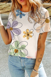 Sophia Summer Floral TeeElevate your summer wardrobe with the Sophia Summer Floral Tee, a stylish essential adorned with a vibrant flower print. Crafted from a soft and breathable fabric blend, this tee ensures all-day comfort and effortless style. The ca