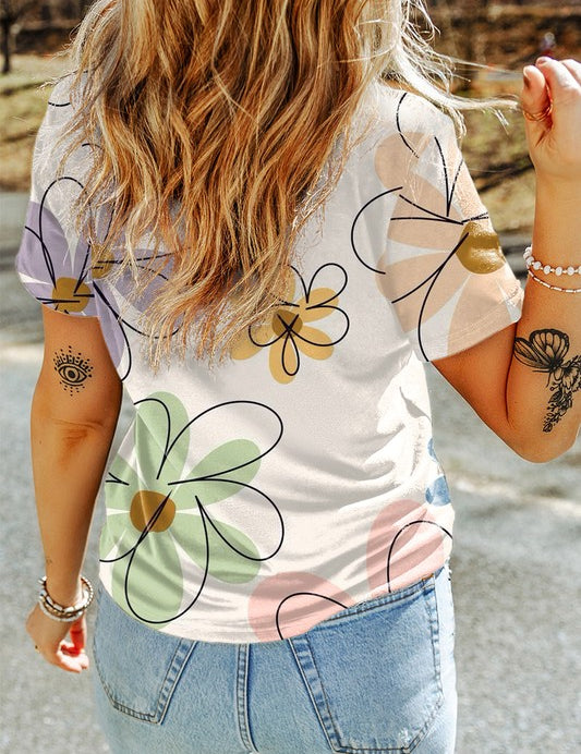 Sophia Summer Floral TeeElevate your summer wardrobe with the Sophia Summer Floral Tee, a stylish essential adorned with a vibrant flower print. Crafted from a soft and breathable fabric blend, this tee ensures all-day comfort and effortless style. The ca