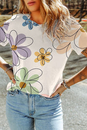 Sophia Summer Floral TeeElevate your summer wardrobe with the Sophia Summer Floral Tee, a stylish essential adorned with a vibrant flower print. Crafted from a soft and breathable fabric blend, this tee ensures all-day comfort and effortless style. The ca