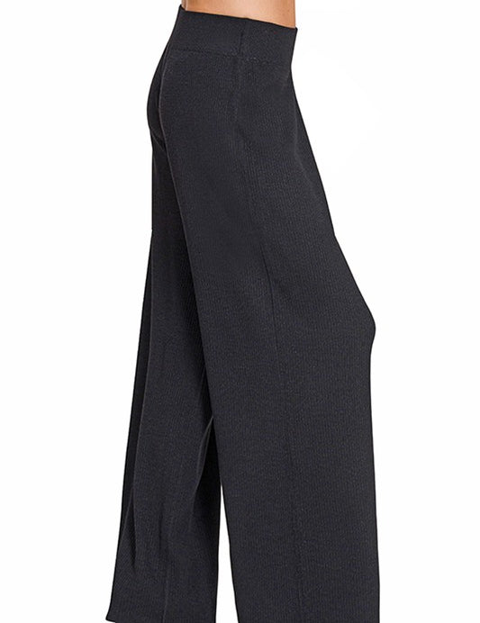 Black Romy Ribbed Sweater Pants with elastic waistband for cozy chic style and comfortable fit.