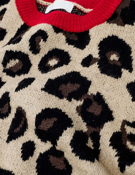 Scarlett Leopard Sweater close-up, featuring soft knit leopard print with vibrant red collar and cuffs.