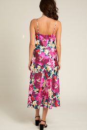 Back view of the Tessa Floral Satin Dress showcasing vibrant floral pattern and delicate satin fabric.