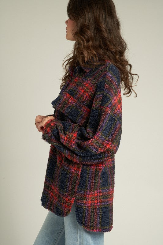 Model wearing the Indie Plaid Shacket in oversized fit with fuzzy fabric and plaid design, perfect for casual layering.