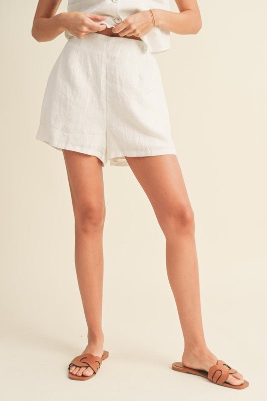 Alice Linen ShortThe Alice Linen Shorts are sure to be your best friend this spring and summer! These 100% linen shorts have a loose, easy fit that is guaranteed to keep you cool and stylish this season. Make it a match with the Bette Tuxedo Vest, or pair