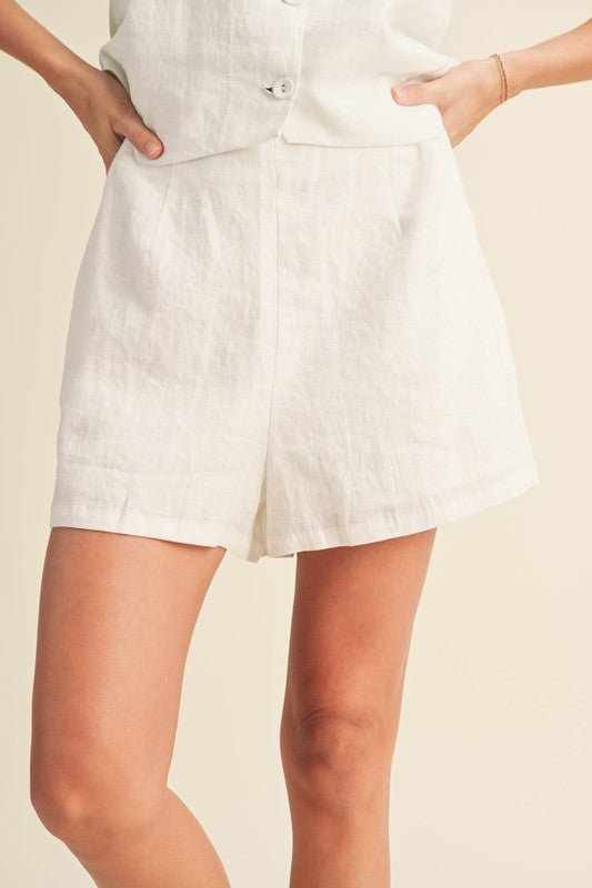 Alice Linen ShortThe Alice Linen Shorts are sure to be your best friend this spring and summer! These 100% linen shorts have a loose, easy fit that is guaranteed to keep you cool and stylish this season. Make it a match with the Bette Tuxedo Vest, or pair