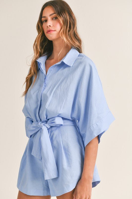 Cali Button Front RomperIntroducing our Cali Solid Button Down Collared Romper, the versatile piece your summer wardrobe has been craving! Crafted with comfort and style in mind, this romper features short sleeves, a classic button-down front, and a sophi