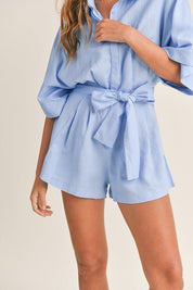 Cali Button Front RomperIntroducing our Cali Solid Button Down Collared Romper, the versatile piece your summer wardrobe has been craving! Crafted with comfort and style in mind, this romper features short sleeves, a classic button-down front, and a sophi