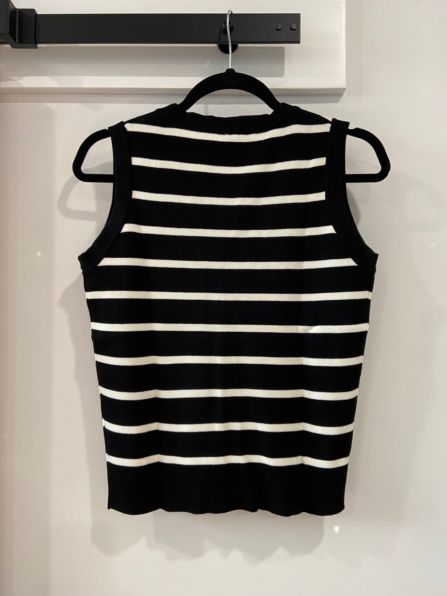 Cleo Stripe Knit VestEnhance your wardrobe with the Cleo Stripe Vest, a versatile sleeveless V-neck contrasting cardigan for women that effortlessly elevates your ensemble. This stylish piece features a flattering V-neck design and contrasting stripes tha