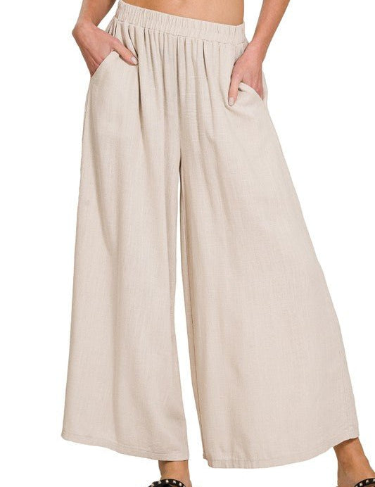 Florence Wide Leg PantIntroducing our Florence Woven Pleated Linen Blend Wide Leg Pants, a chic and versatile addition to your wardrobe. Crafted from a premium linen blend, these pants offer both style and comfort for any occasion. Featuring a flattering