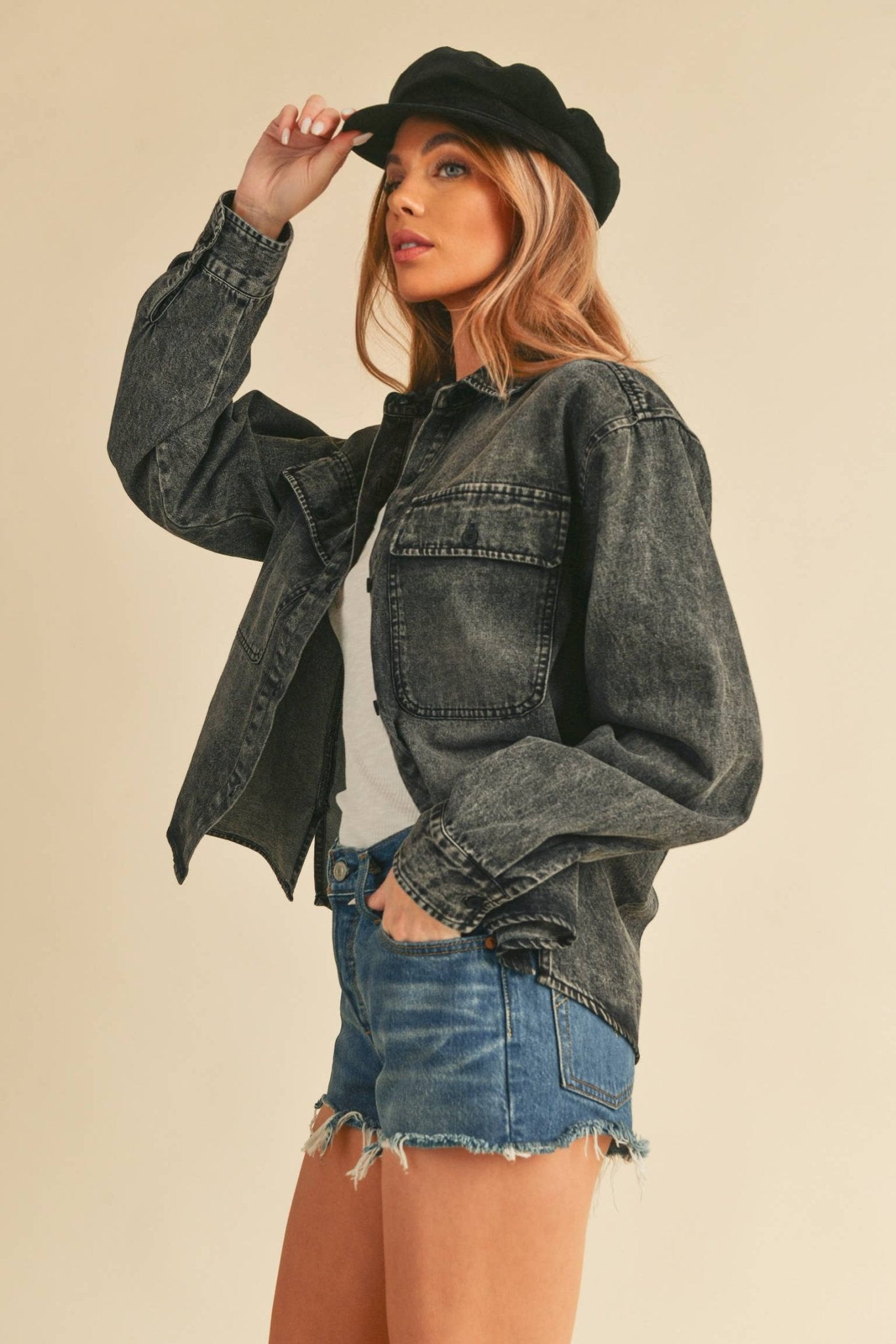 Genny Denim TopRevamp your style with this Genny faded denim shirt. Featuring button closure, spread collar, and long sleeves with button cuffs. The high-low hem adds a touch of edge, while the button-close chest pockets offer functionality and flair. Ele