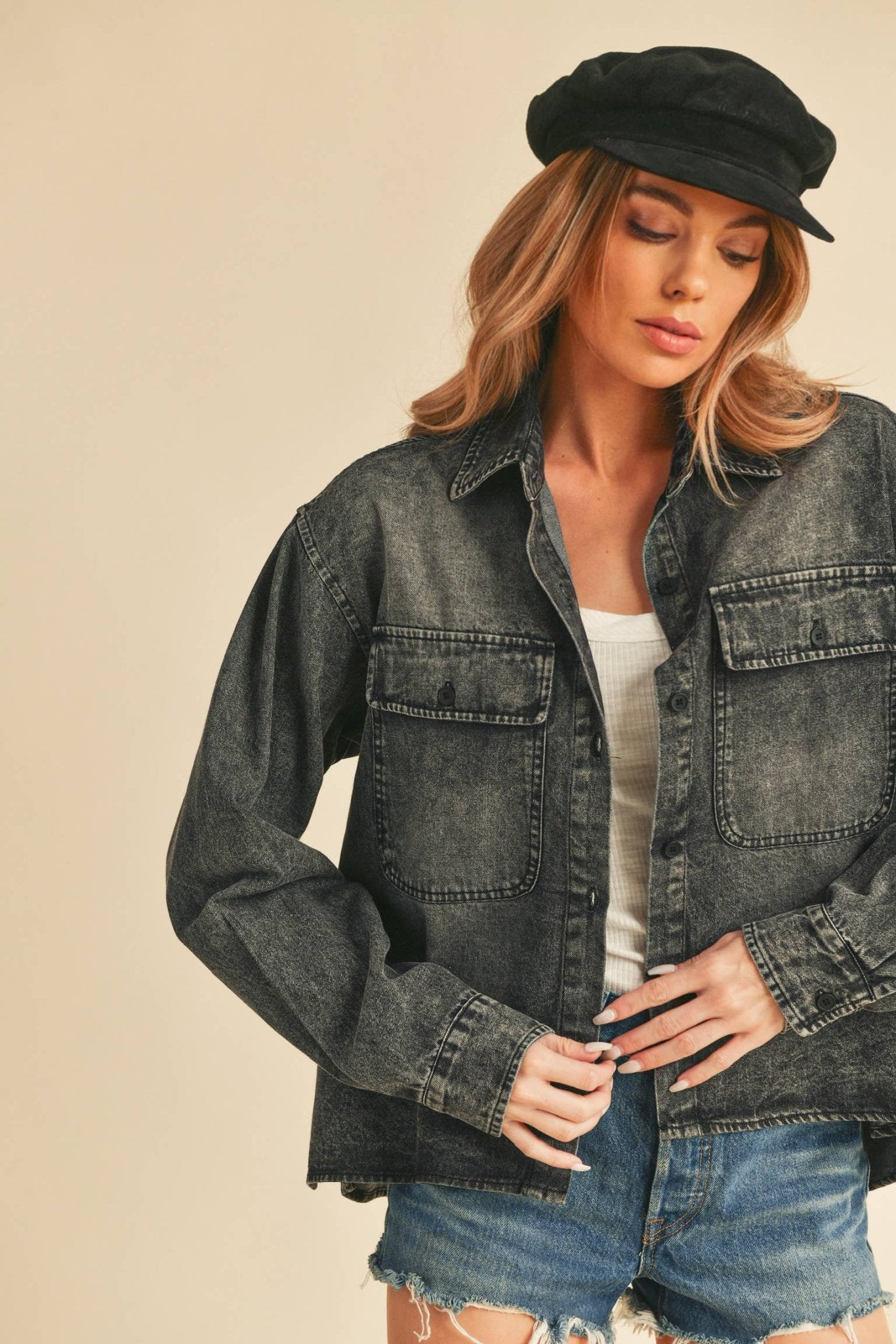 Genny Denim TopRevamp your style with this Genny faded denim shirt. Featuring button closure, spread collar, and long sleeves with button cuffs. The high-low hem adds a touch of edge, while the button-close chest pockets offer functionality and flair. Ele