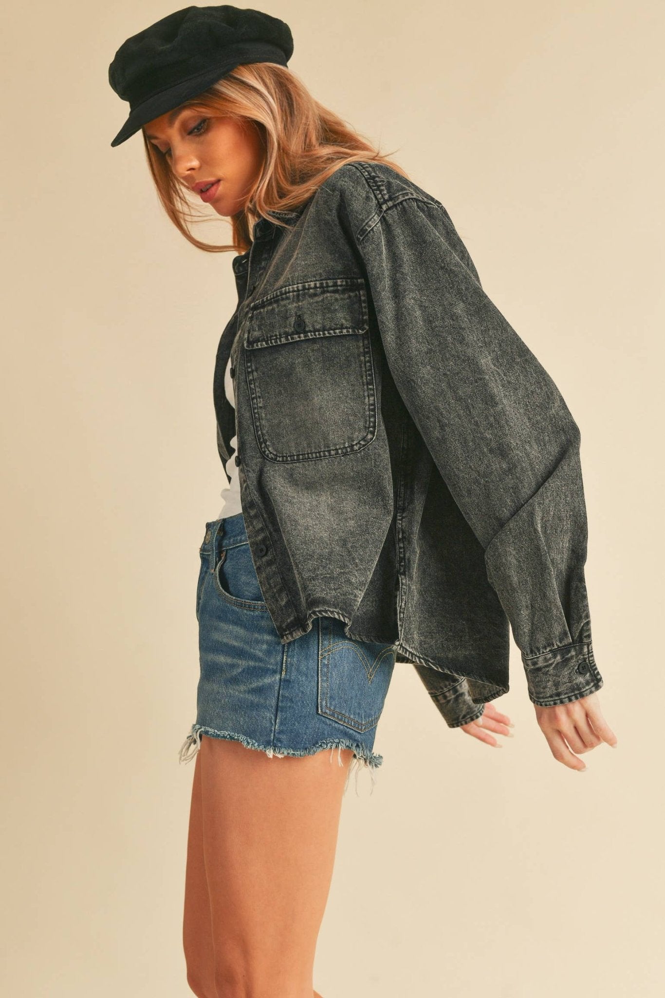 Genny Denim TopRevamp your style with this Genny faded denim shirt. Featuring button closure, spread collar, and long sleeves with button cuffs. The high-low hem adds a touch of edge, while the button-close chest pockets offer functionality and flair. Ele