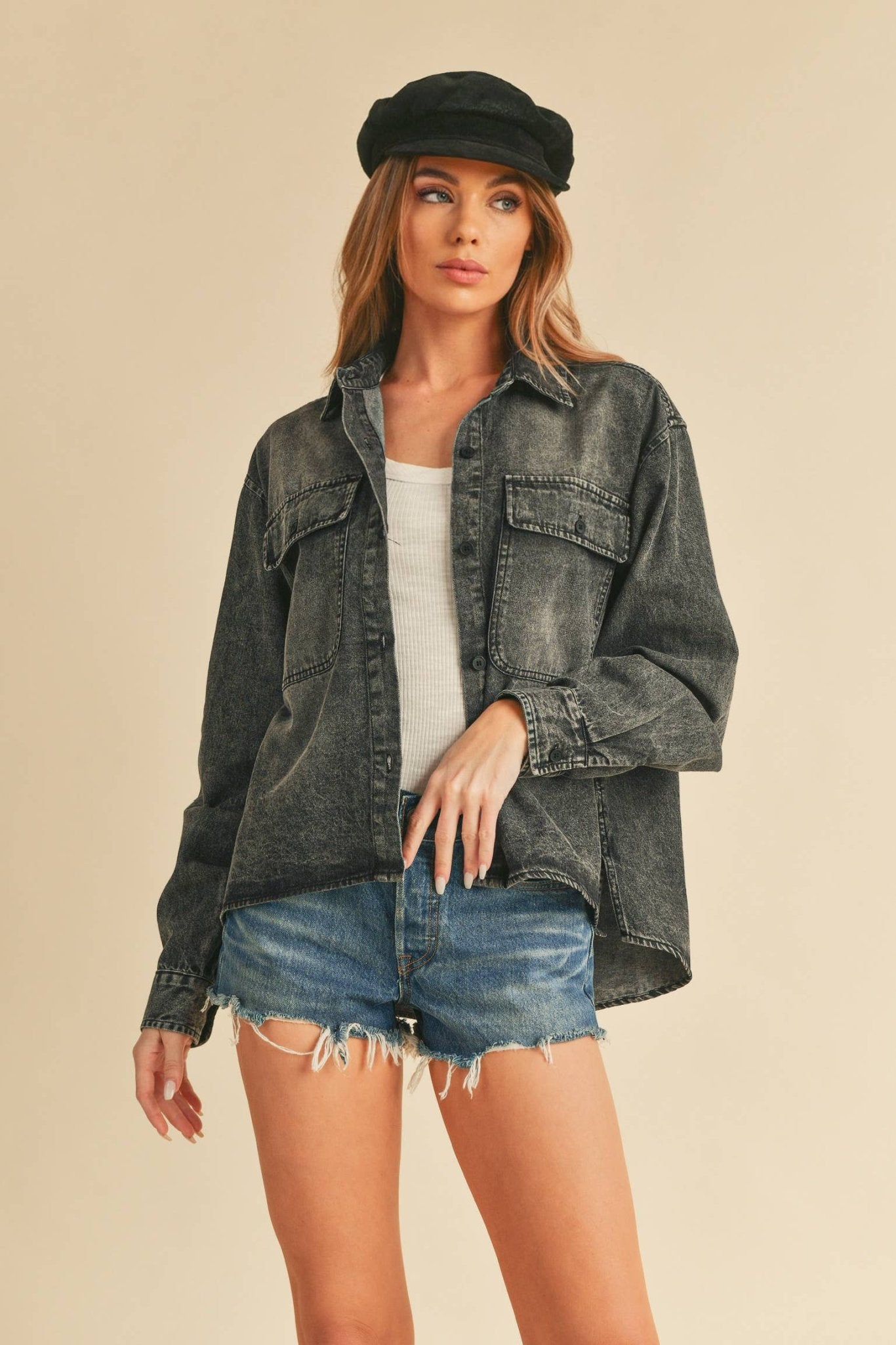 Genny Denim TopRevamp your style with this Genny faded denim shirt. Featuring button closure, spread collar, and long sleeves with button cuffs. The high-low hem adds a touch of edge, while the button-close chest pockets offer functionality and flair. Ele