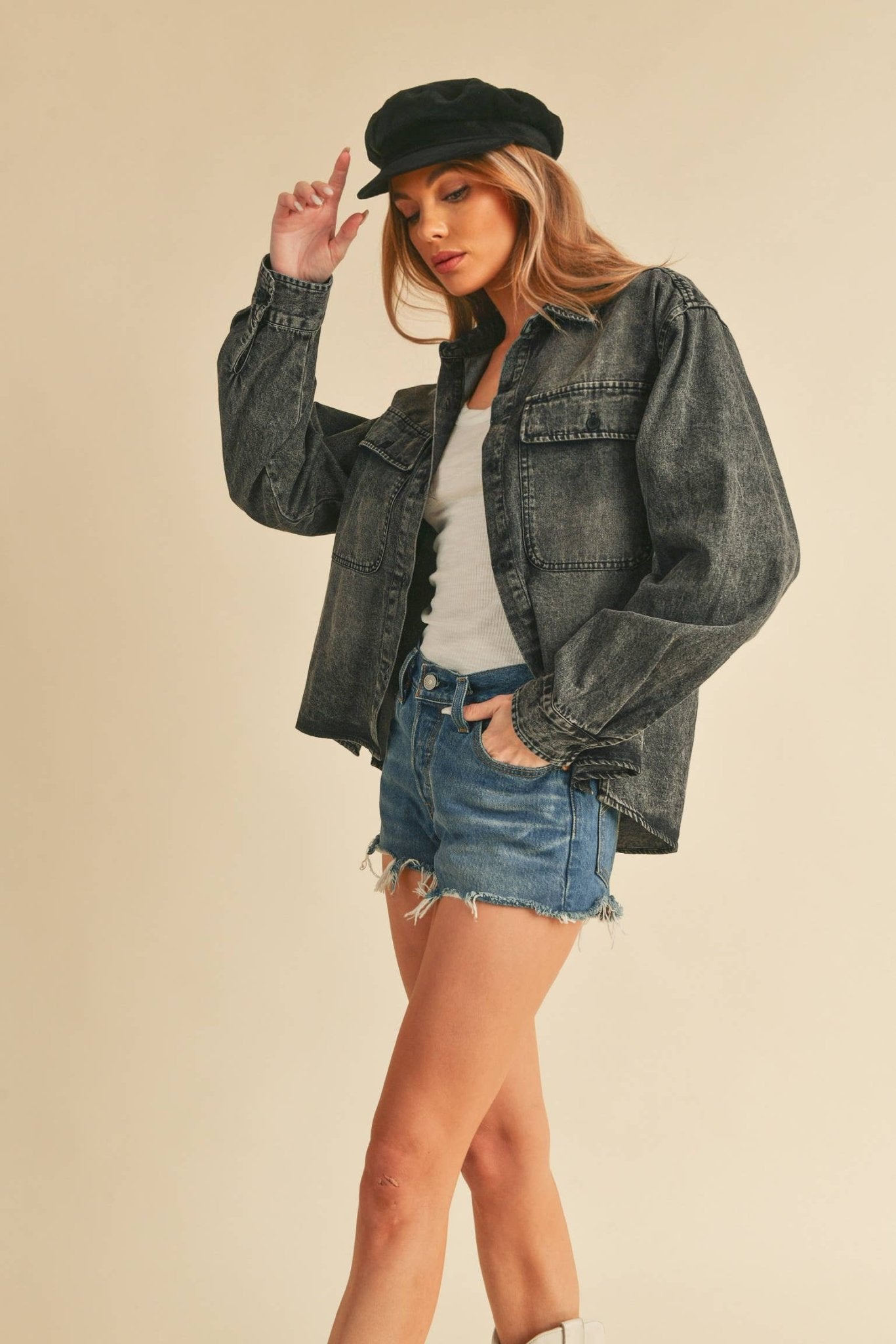 Genny Denim TopRevamp your style with this Genny faded denim shirt. Featuring button closure, spread collar, and long sleeves with button cuffs. The high-low hem adds a touch of edge, while the button-close chest pockets offer functionality and flair. Ele