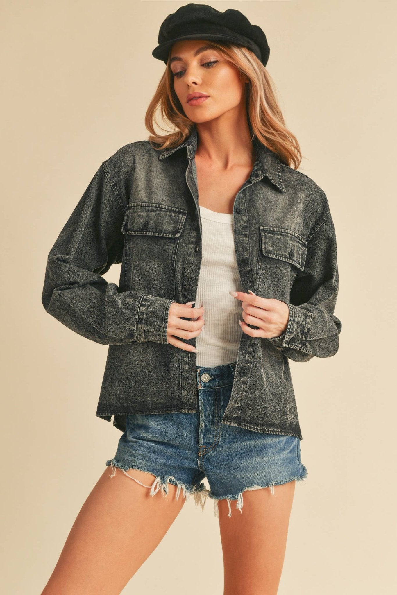 Genny Denim TopRevamp your style with this Genny faded denim shirt. Featuring button closure, spread collar, and long sleeves with button cuffs. The high-low hem adds a touch of edge, while the button-close chest pockets offer functionality and flair. Ele