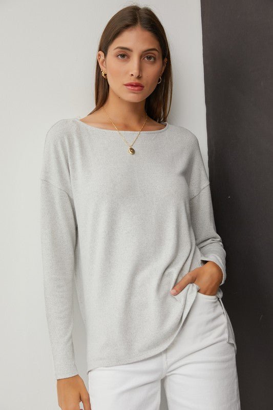 Hacci Wide Neck TopMeet our Flowy Wide Neck Knit Top, the epitome of comfort and style. Crafted from ultra-soft knit fabric, this top offers a luxurious feel against the skin. Its flattering wide neckline adds a touch of elegance, while the flowy hemline