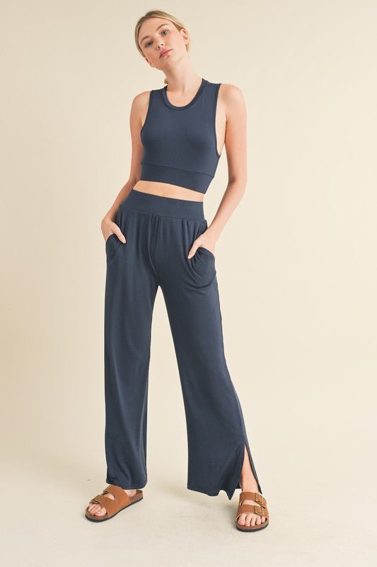 Jet Stream Lounge SetWelcome the Jet Stream Lounge Set! The Long-Length Wide Leg Pants feature a sleek and sophisticated design crafted from a soft and breathable fabric. With their elongating silhouette and wide-leg cut, these pants offer a flattering fi