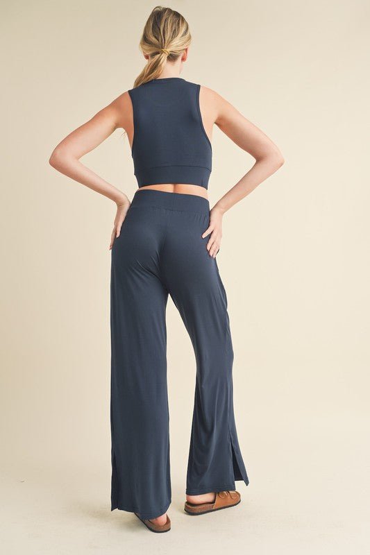 Jet Stream Lounge SetWelcome the Jet Stream Lounge Set! The Long-Length Wide Leg Pants feature a sleek and sophisticated design crafted from a soft and breathable fabric. With their elongating silhouette and wide-leg cut, these pants offer a flattering fi