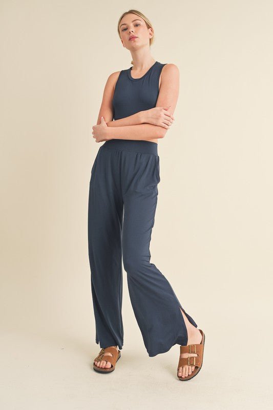 Jet Stream Lounge SetWelcome the Jet Stream Lounge Set! The Long-Length Wide Leg Pants feature a sleek and sophisticated design crafted from a soft and breathable fabric. With their elongating silhouette and wide-leg cut, these pants offer a flattering fi