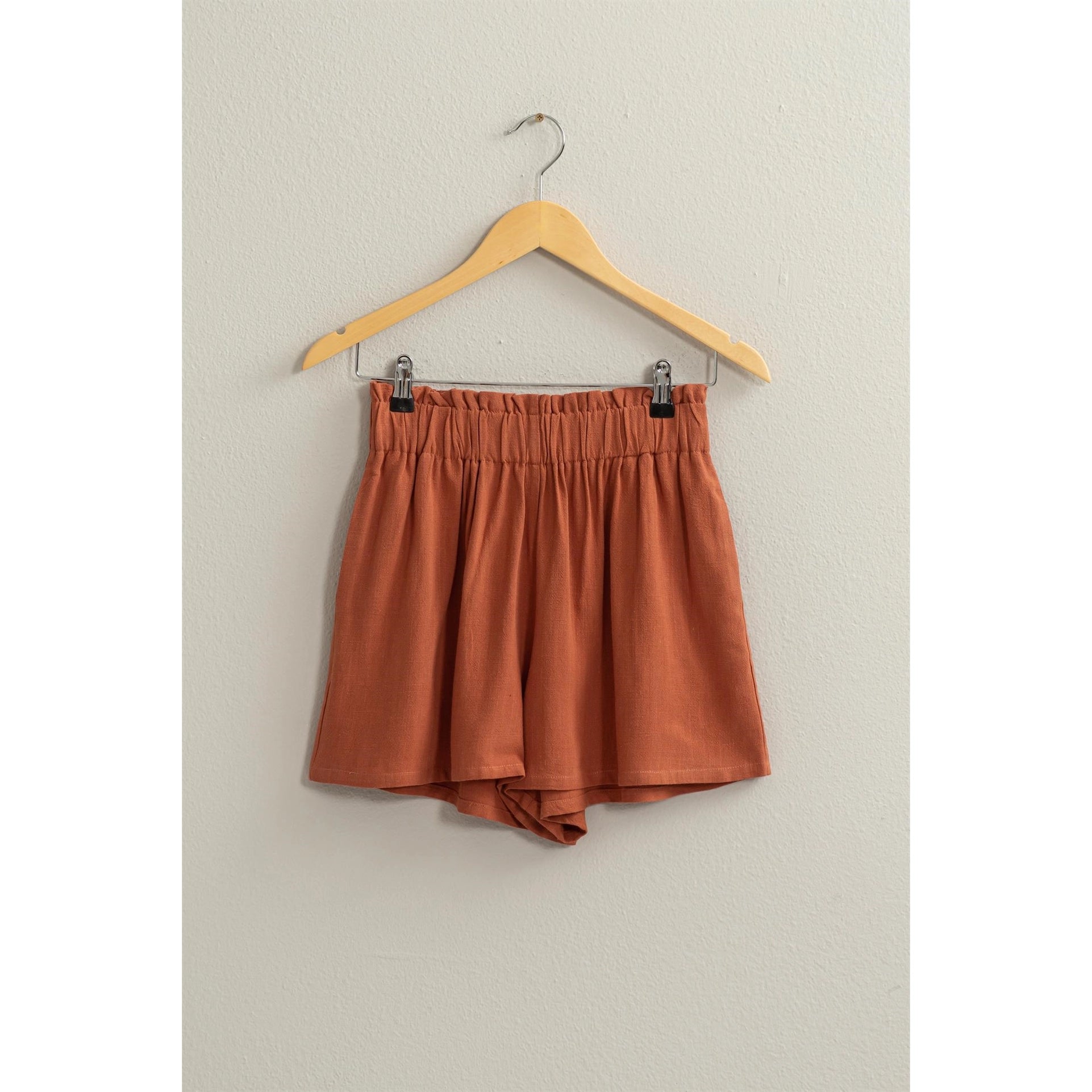 Lynne Paper Bag ShortsIntroducing our Lynne Paper Bag Waist Relaxed Shorts, the epitome of chic and comfort. Elevate your summer wardrobe with these effortlessly stylish shorts, featuring a paper bag elasticated high waist that cinches the fit for a flatt