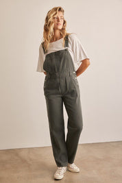 Nellie OverallsStep into effortless style with our Deep Pocket Detail Denim Overall Jumpsuit. Designed for both comfort and fashion-forward flair, this jumpsuit is a versatile addition to any wardrobe. The adjustable wide straps with buckle clips ensure a