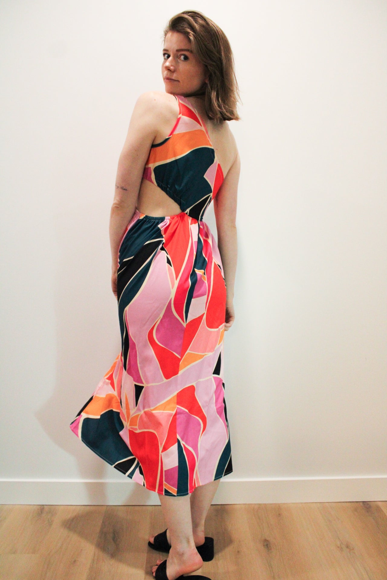 Nora Printed DressStep into summer with the Nora Printed Dress, a stunning one-shoulder design that exudes effortless elegance. Featuring a vibrant print and a small insert at the waist, this dress is perfect for making a statement at any occasion. The on