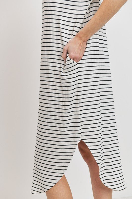 Rina Stripe DressIntroducing our Rounded Hems Striped Rib Knit Dress, effortlessly blending comfort with style. Crafted from a heavyweight, stretchy rib knit fabric, this dress features a relaxed silhouette with rounded hems and convenient pockets. With a