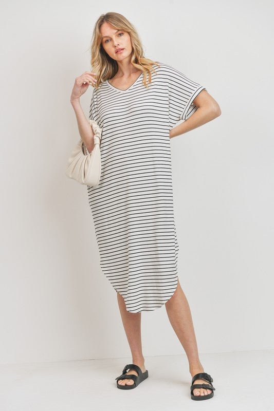 Rina Stripe DressIntroducing our Rounded Hems Striped Rib Knit Dress, effortlessly blending comfort with style. Crafted from a heavyweight, stretchy rib knit fabric, this dress features a relaxed silhouette with rounded hems and convenient pockets. With a