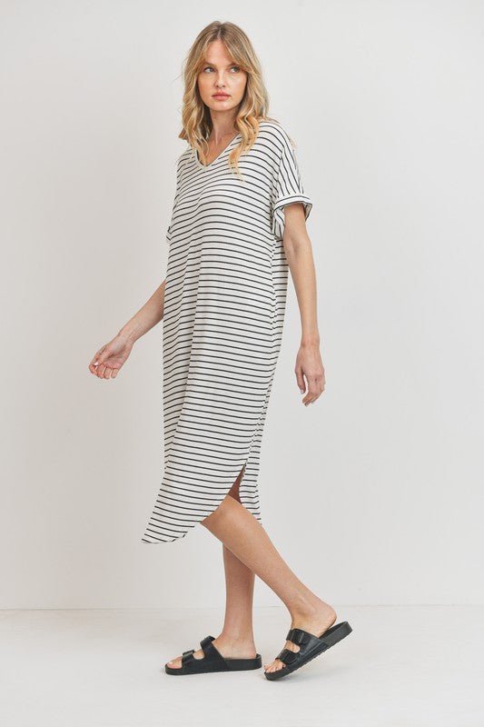 Rina Stripe DressIntroducing our Rounded Hems Striped Rib Knit Dress, effortlessly blending comfort with style. Crafted from a heavyweight, stretchy rib knit fabric, this dress features a relaxed silhouette with rounded hems and convenient pockets. With a