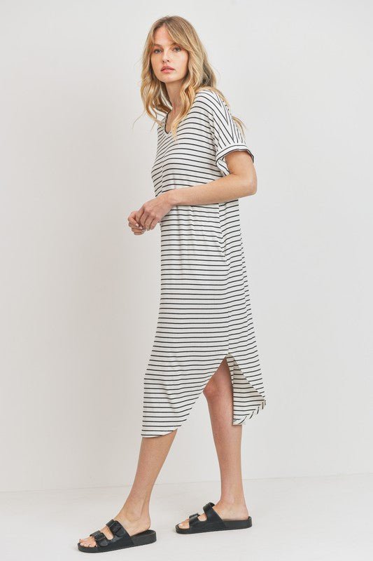 Rina Stripe DressIntroducing our Rounded Hems Striped Rib Knit Dress, effortlessly blending comfort with style. Crafted from a heavyweight, stretchy rib knit fabric, this dress features a relaxed silhouette with rounded hems and convenient pockets. With a