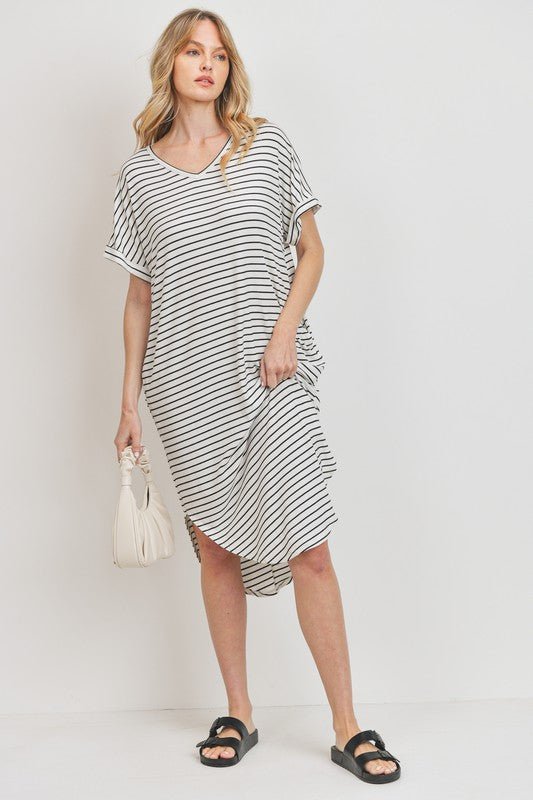 Rina Stripe DressIntroducing our Rounded Hems Striped Rib Knit Dress, effortlessly blending comfort with style. Crafted from a heavyweight, stretchy rib knit fabric, this dress features a relaxed silhouette with rounded hems and convenient pockets. With a