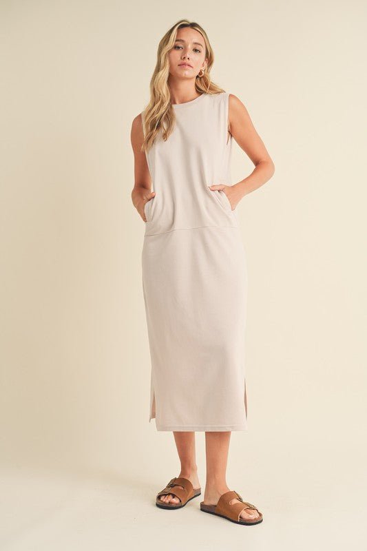 Rosie Midi DressIntroducing our Sleeveless Terry Cloth Midi Dress – a blend of comfort and style for your summer wardrobe.Crafted from soft terry cloth fabric, this midi-length dress keeps you cool and cozy all day. The sleeveless design is perfect for su