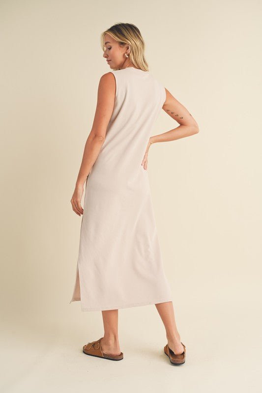 Rosie Midi DressIntroducing our Sleeveless Terry Cloth Midi Dress – a blend of comfort and style for your summer wardrobe.Crafted from soft terry cloth fabric, this midi-length dress keeps you cool and cozy all day. The sleeveless design is perfect for su